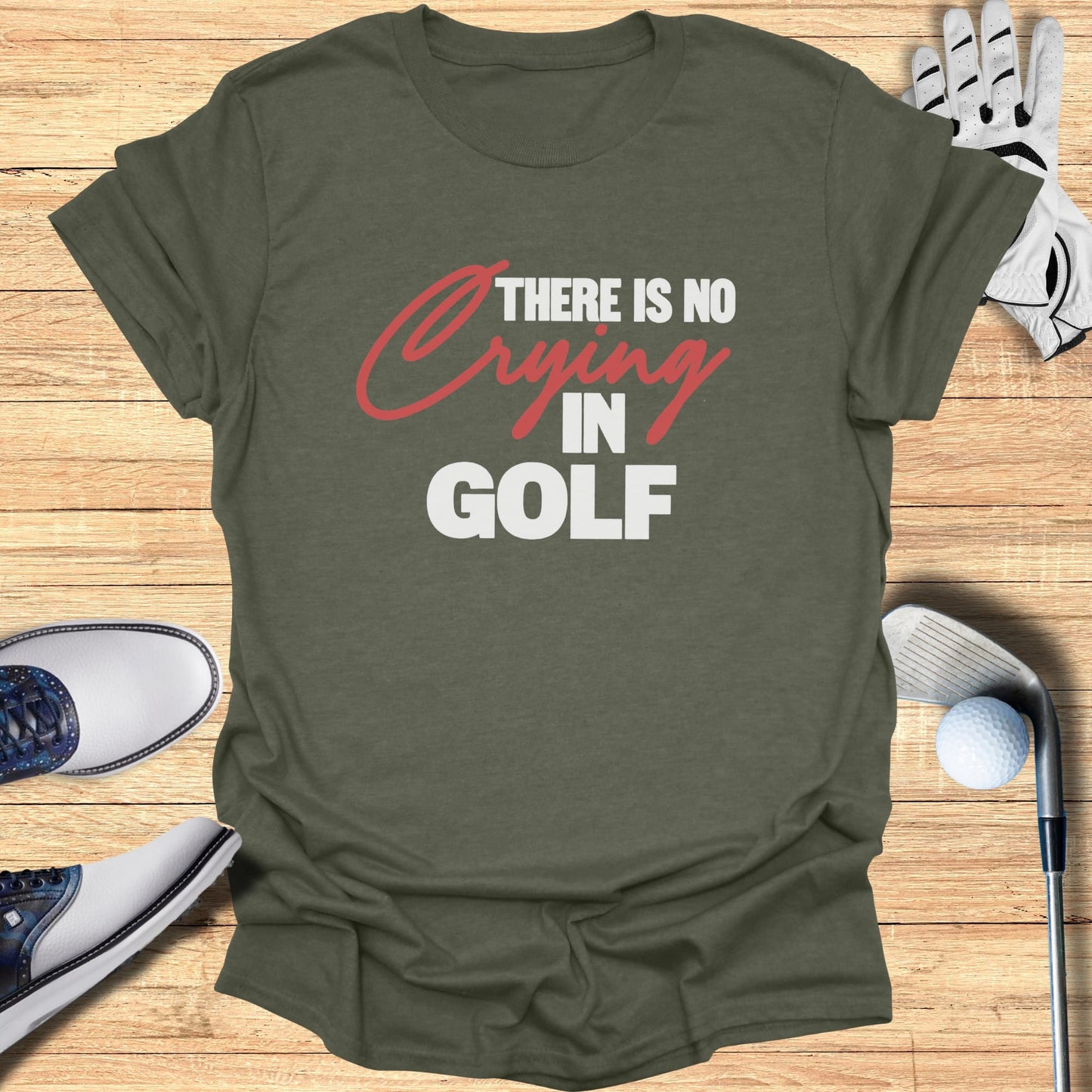 Olive green t-shirt with "There is no crying in golf" text.