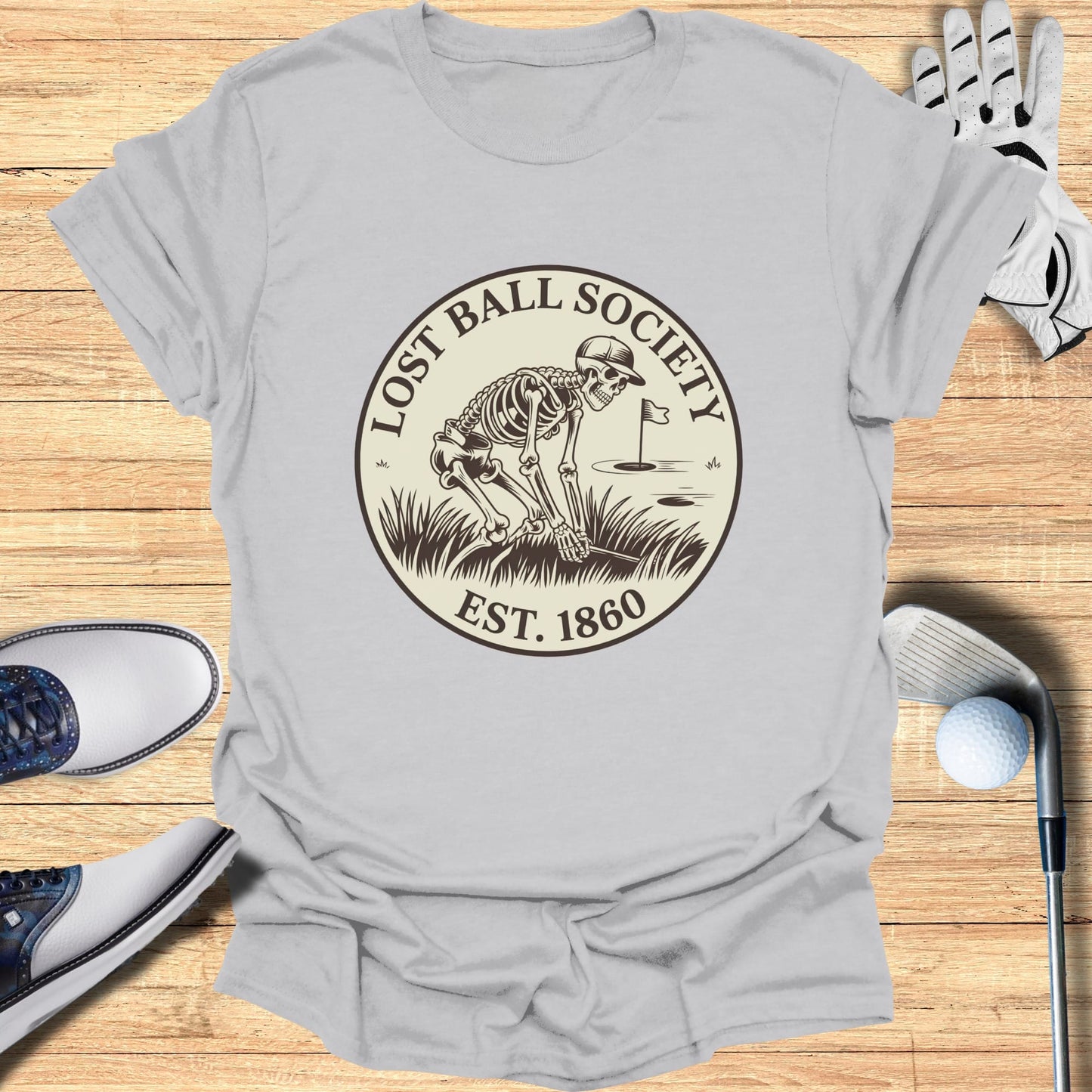 T-shirt with Lost Ball Society skeleton golf logo, est. 1860.