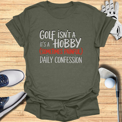 Olive green t-shirt with "Golf isn't a hobby, it's a daily confession" text.