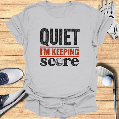 Gray t-shirt with "QUIET I'M KEEPING SCORE" text and a golf ball.