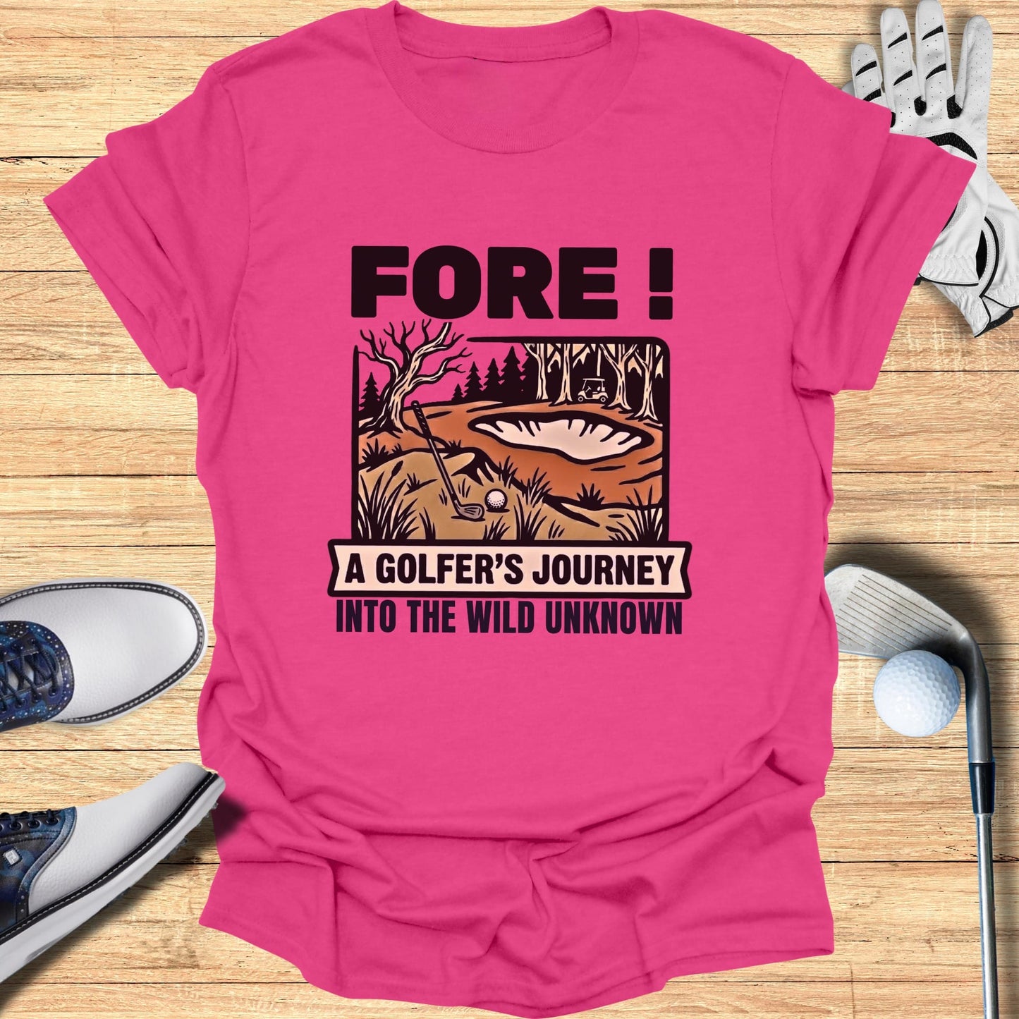 Pink t-shirt with "Fore! A Golfer's Journey Into The Wild Unknown" text and golf scene.