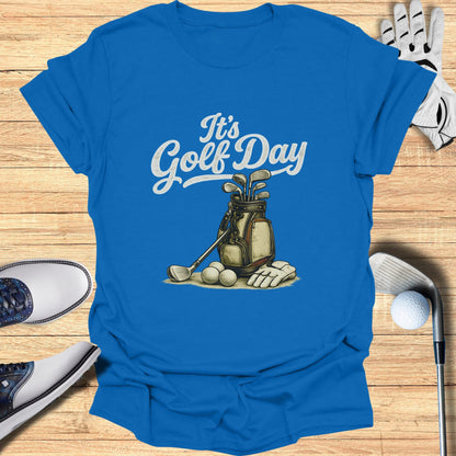 Blue t-shirt with "It's Golf Day" text and golf bag graphic.
