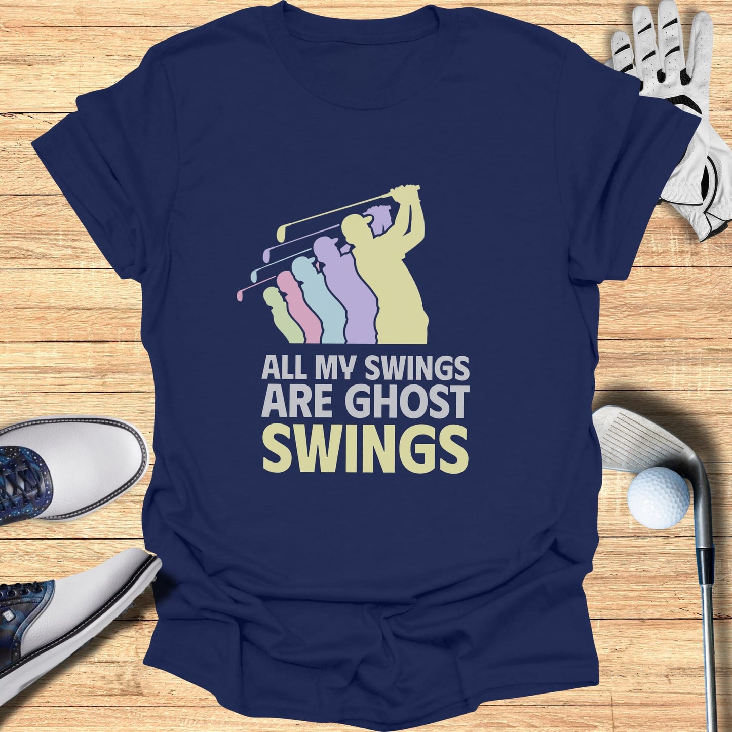 Navy t-shirt with "ALL MY SWINGS ARE GHOST SWINGS" and pastel golf figures.