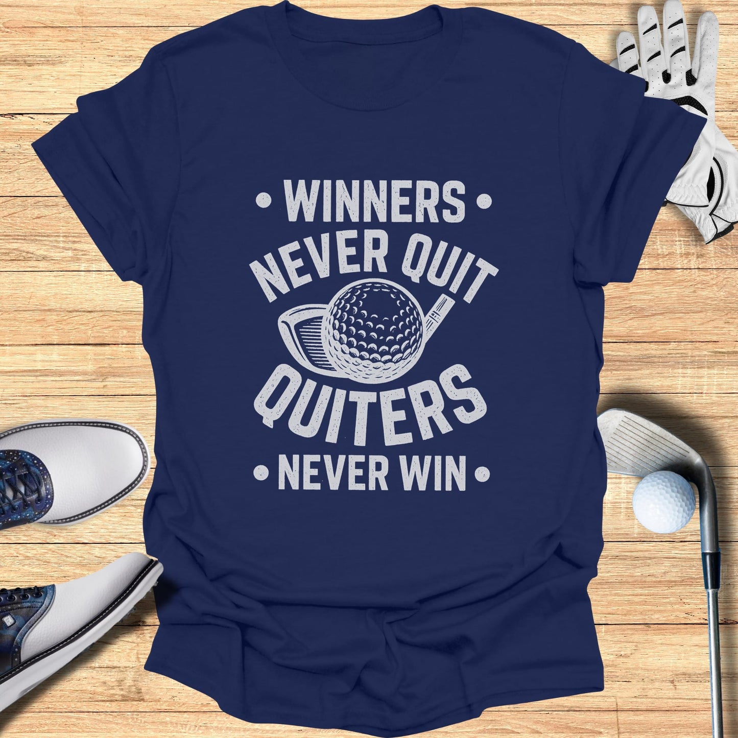 Navy t-shirt with white text "Winners Never Quit Quitters Never Win" and golf imagery.
