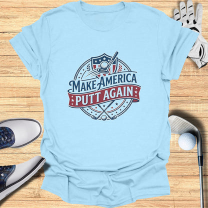 Light blue t-shirt with "Make America Putt Again" text and golf graphic.