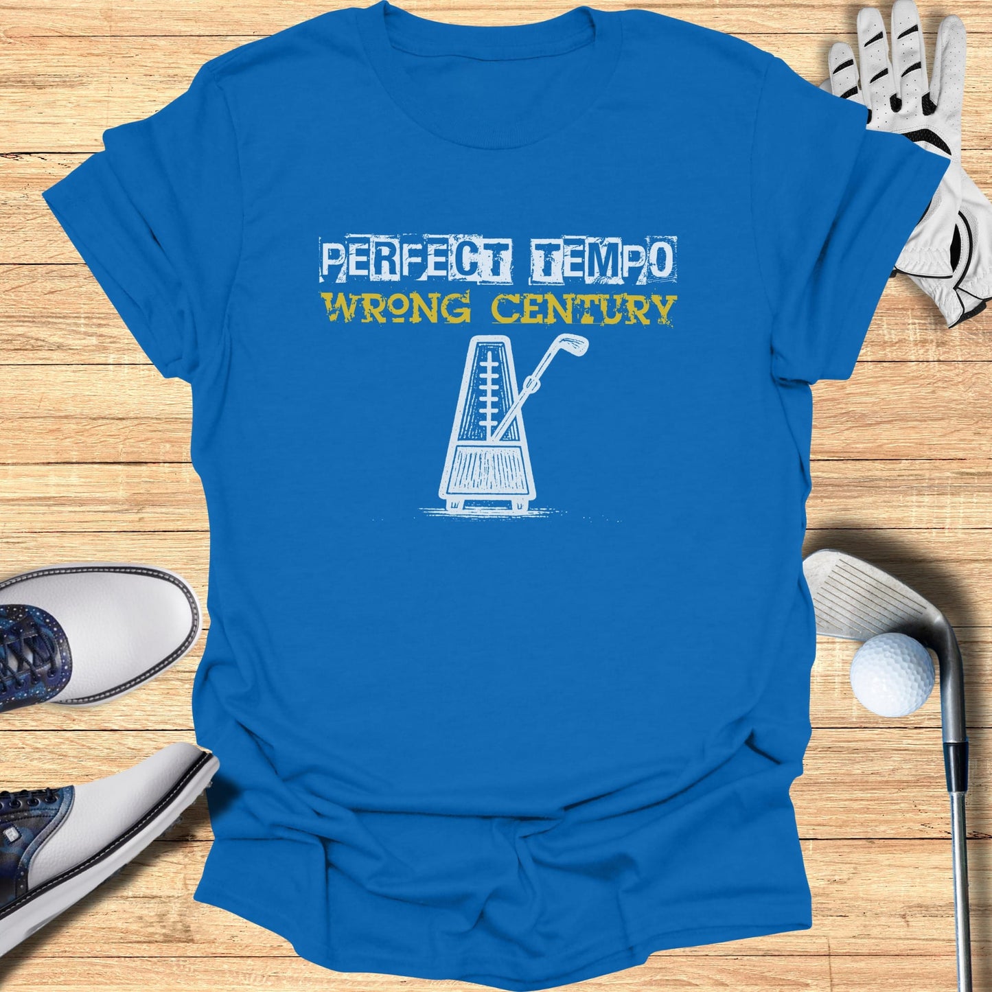 Blue t-shirt with a graphic of a metronome and text "PERFECT TEMPO WRONG CENTURY".