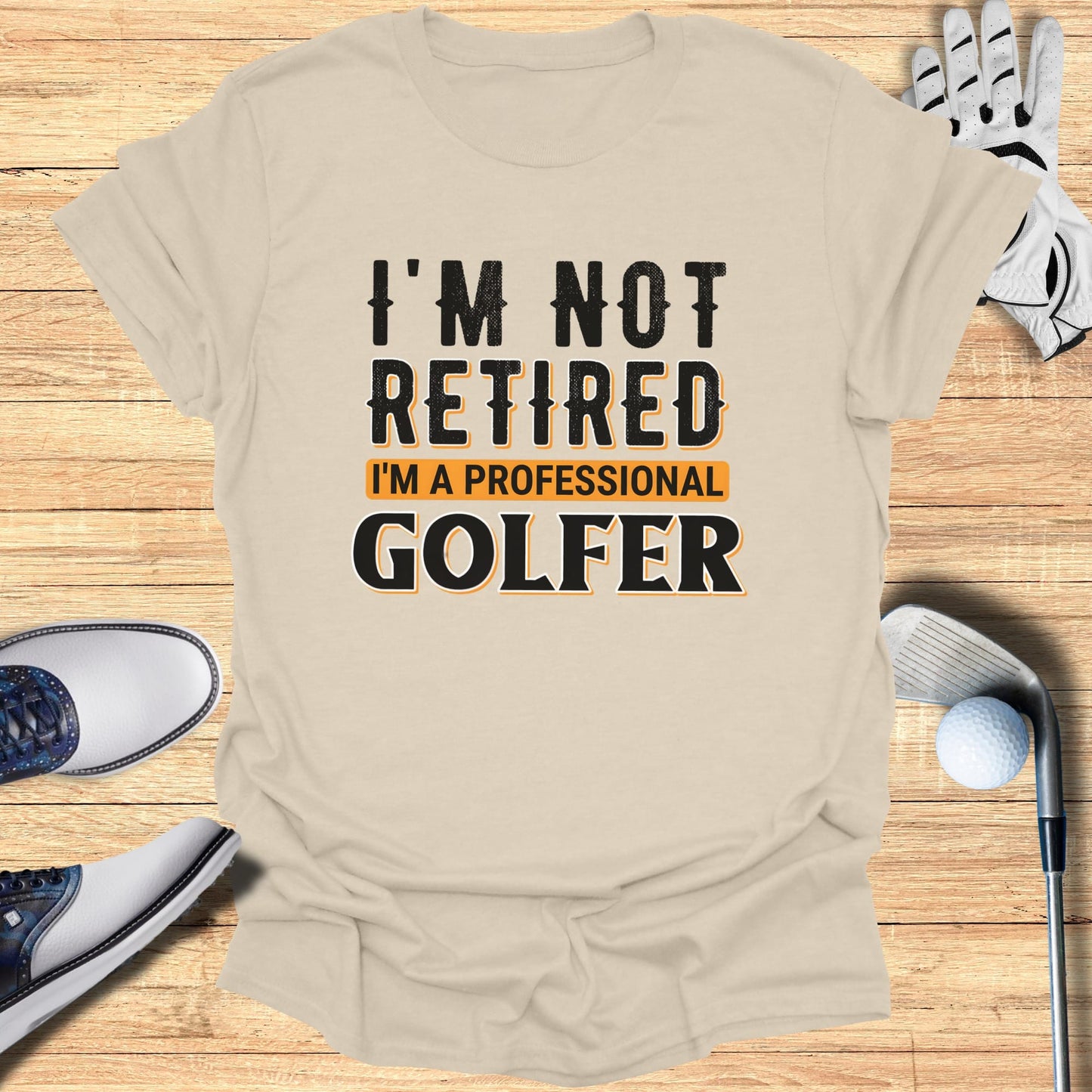 Beige t-shirt with "I'm Not Retired I'm A Professional Golfer" text.