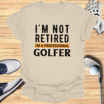 Beige t-shirt with "I'm Not Retired I'm A Professional Golfer" text.