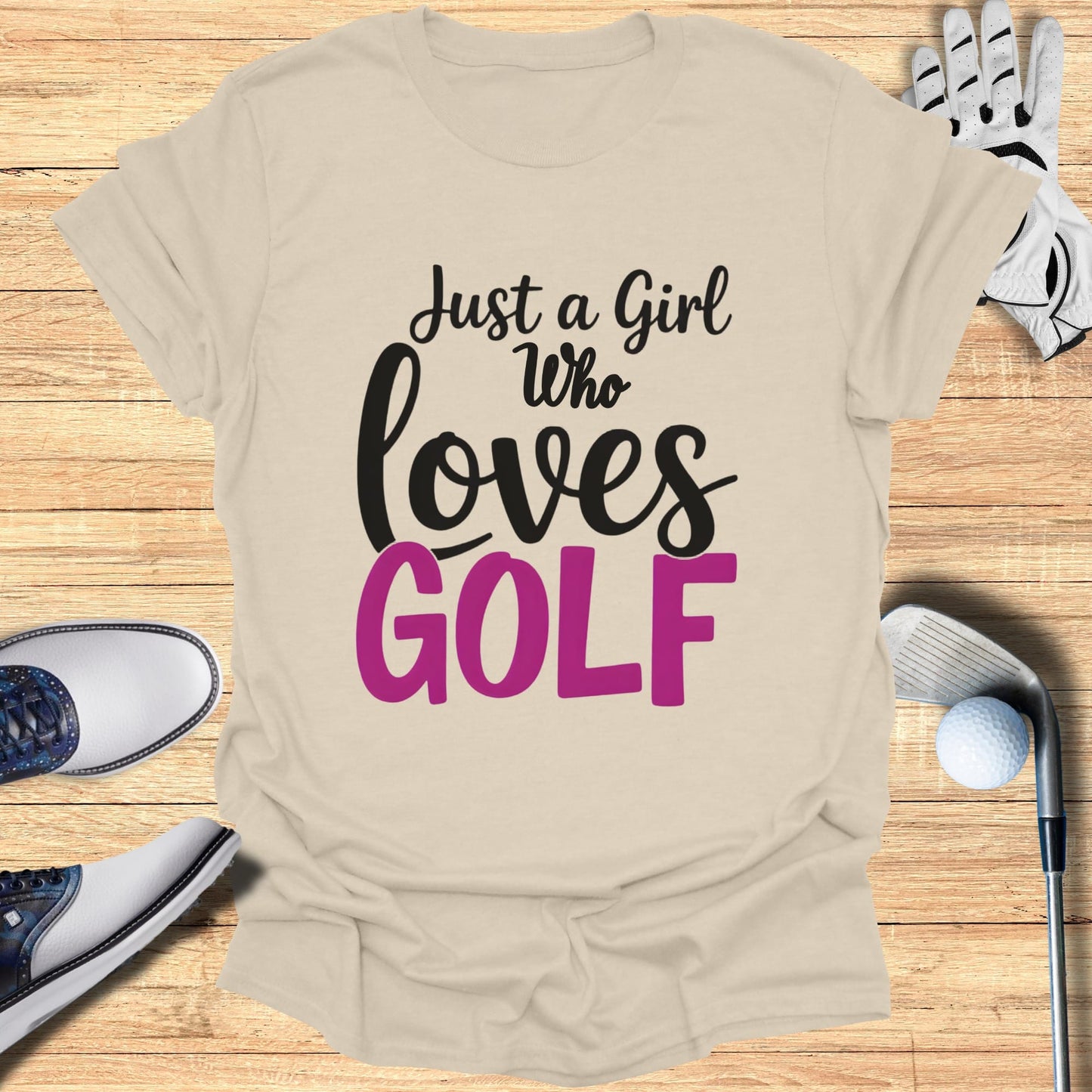 Beige t-shirt with "Just a Girl who loves GOLF" graphic, golf club, glove, shoes, and ball.