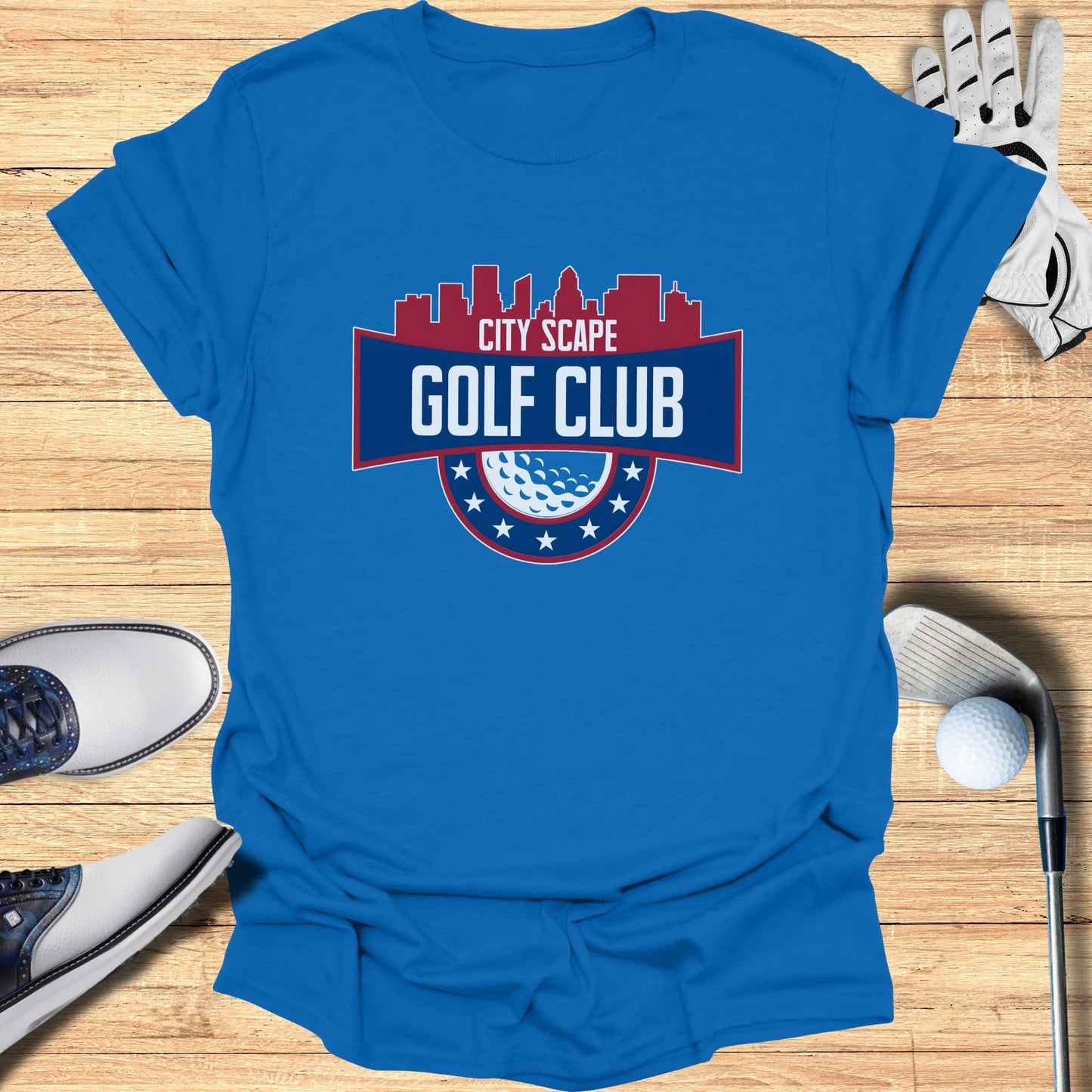 Blue t-shirt with "City Scape Golf Club" logo and golf accessories.