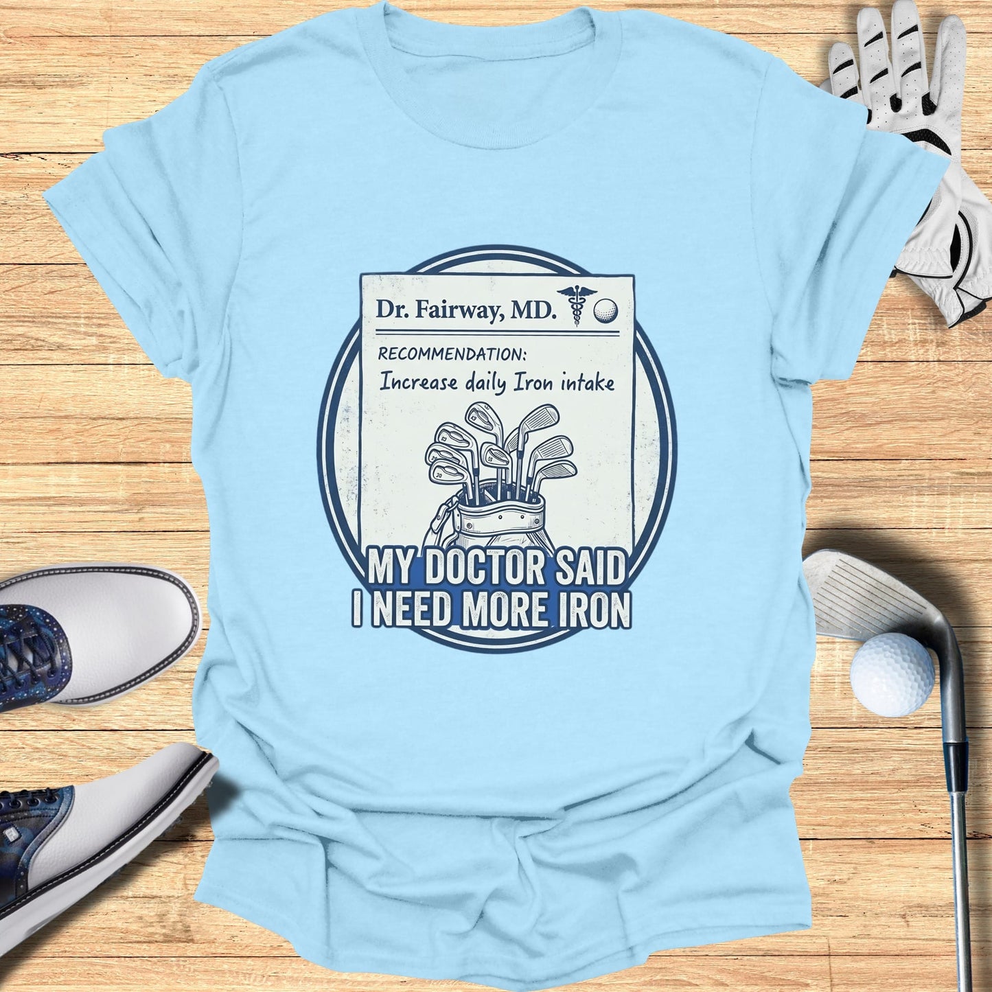 Light blue t-shirt with a medical card illustration about golf and iron.