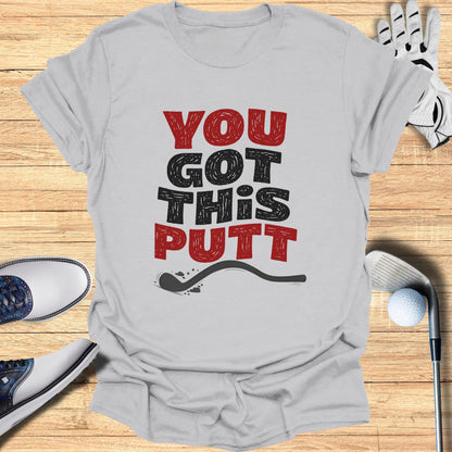 T-shirt with "You Got This Putt" text and golf equipment.
