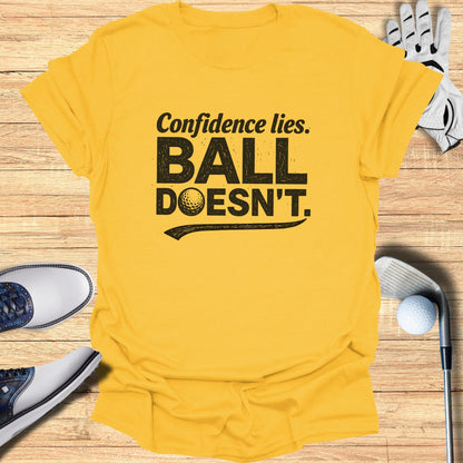 Yellow t-shirt with "Confidence lies. BALL DOESN'T." text and golf accessories.