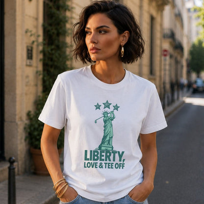 Woman wearing white t-shirt with Statue of Liberty and golf club graphic.