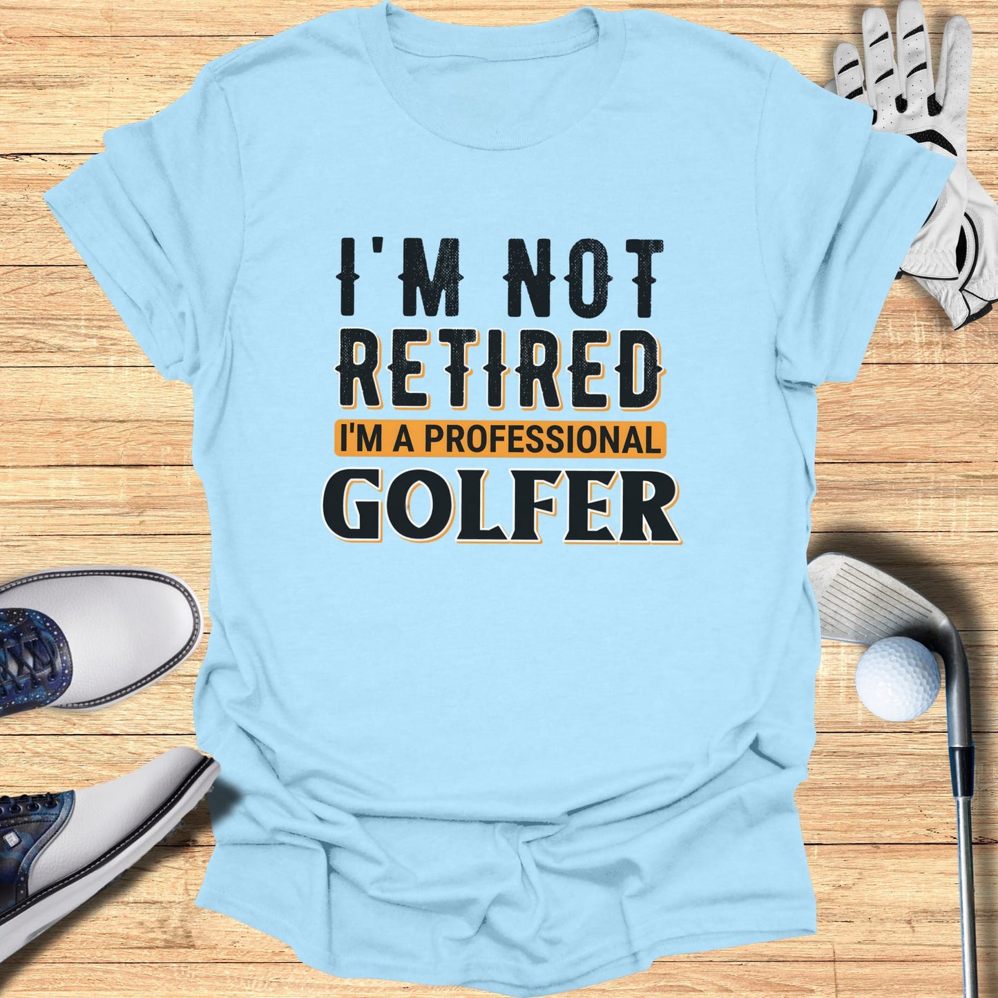 Light blue t-shirt with "I'm Not Retired I'm A Professional Golfer" text.