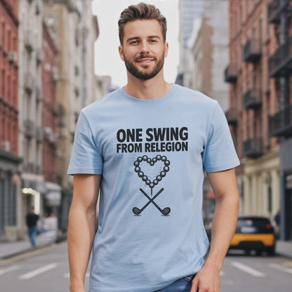 Light blue t-shirt with "ONE SWING FROM RELEGION" and golf club heart graphic.