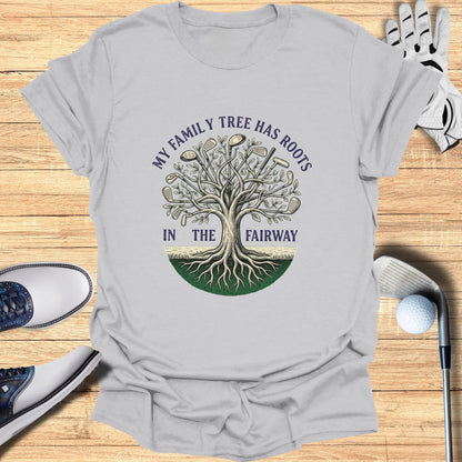 T-shirt with "My family tree has roots in the fairway" golf-themed graphic.