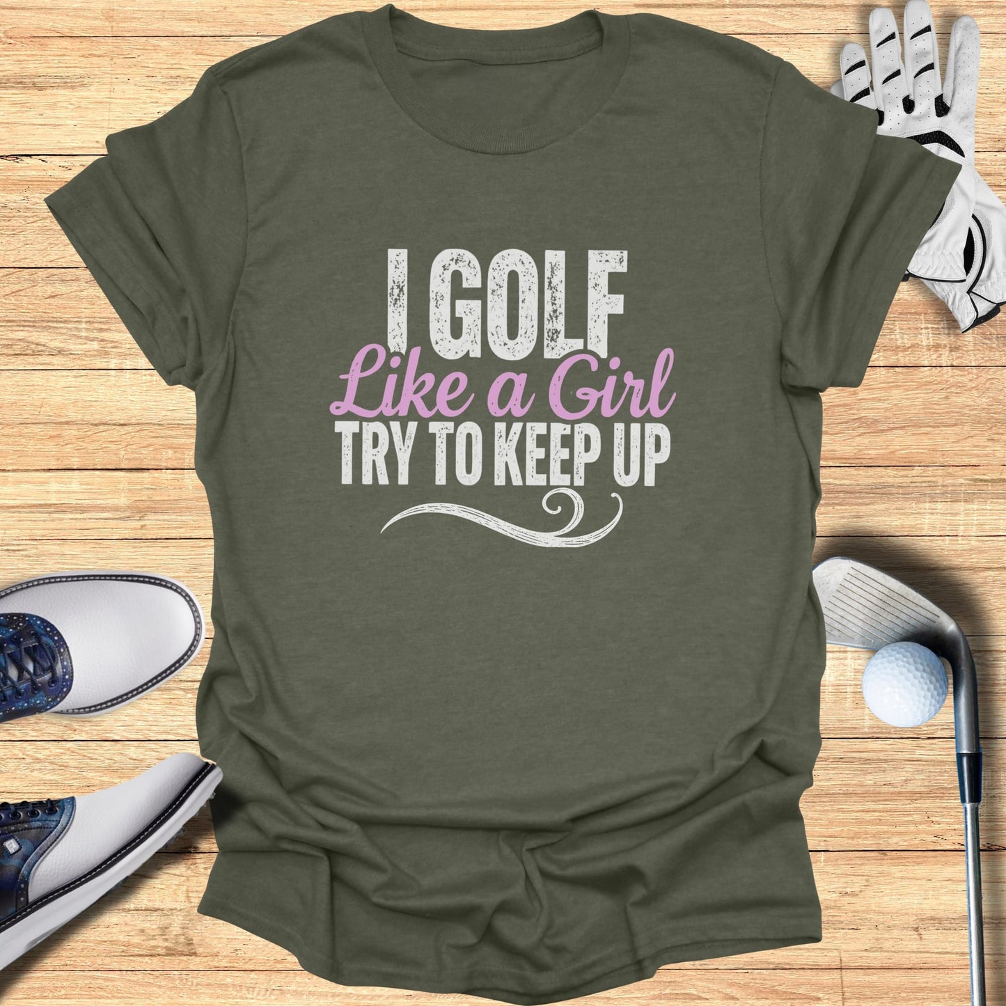 Olive green t-shirt with "I Golf Like a Girl" text.