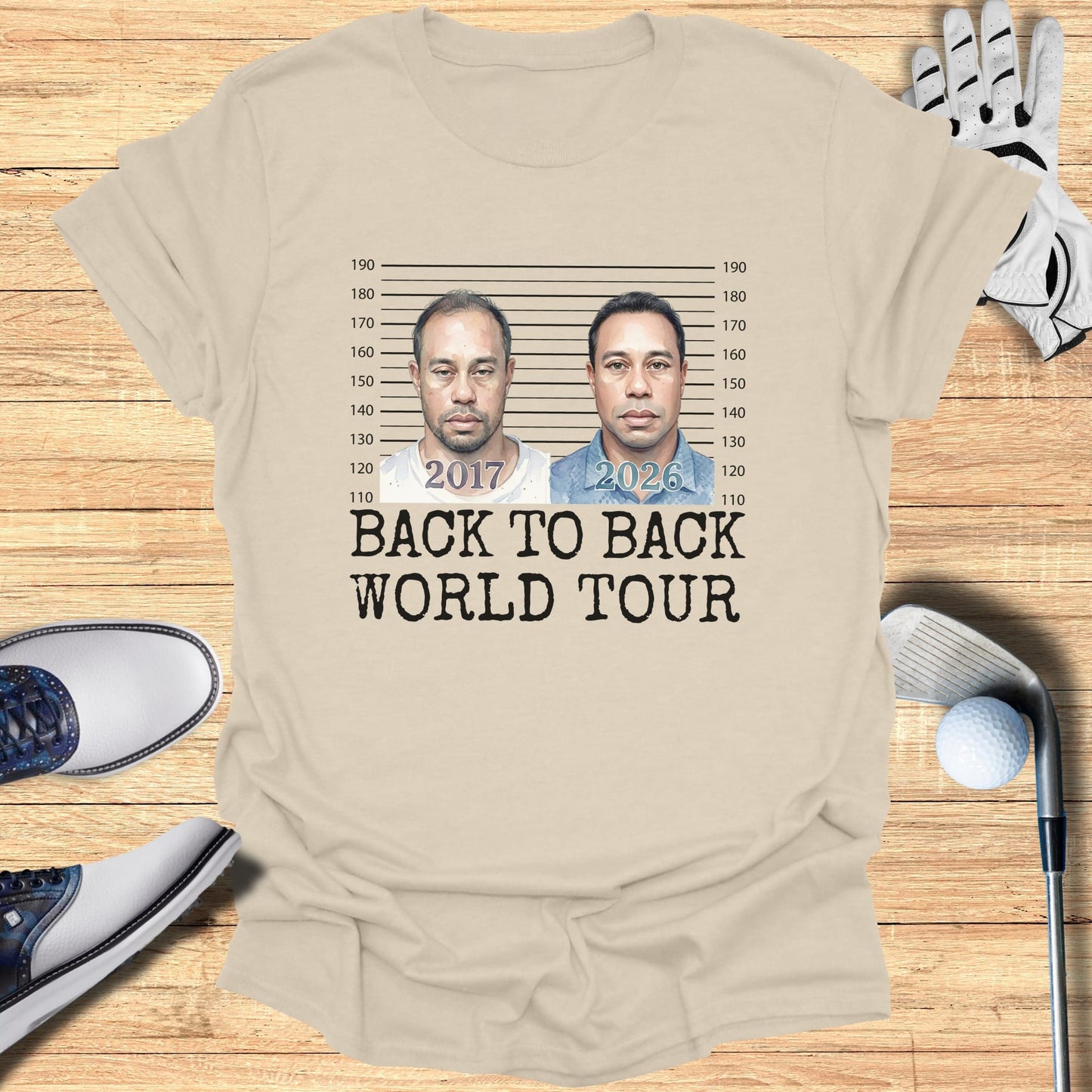 T-shirt with mugshot-style portraits of Tiger Woods labeled 2017 and 2026.