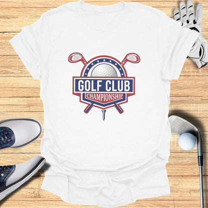 Golf Club Championship logo on a white t-shirt with golf clubs and shoes.