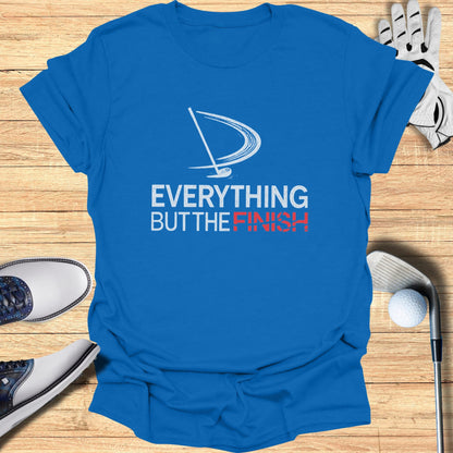 Blue t-shirt with white and red "EVERYTHING BUT THE FINISH" text and golf graphic.