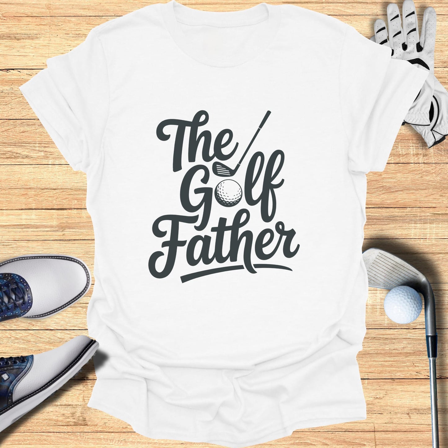 White t-shirt with "The Golf Father" text and golf accessories.