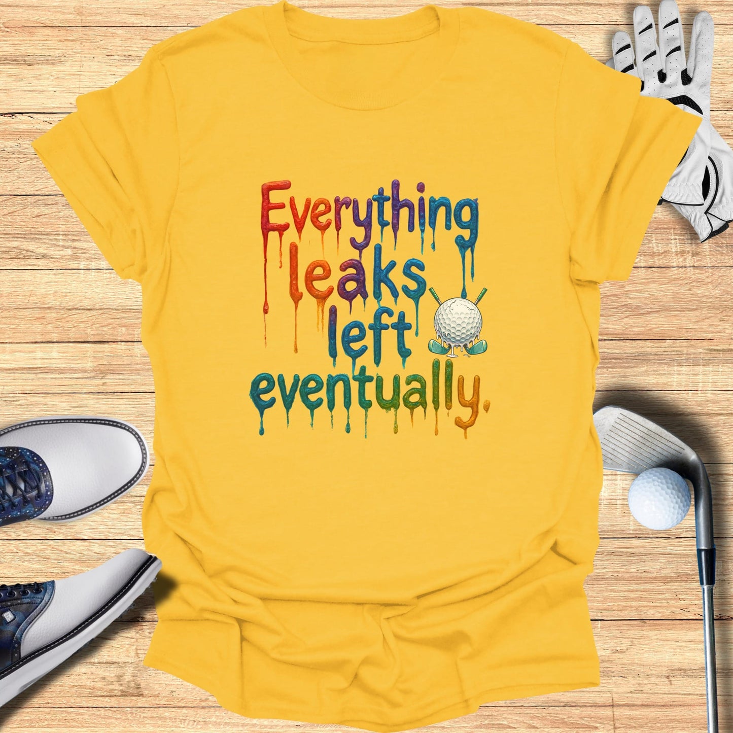Yellow t-shirt with "Everything leaks eventually" and golf imagery.
