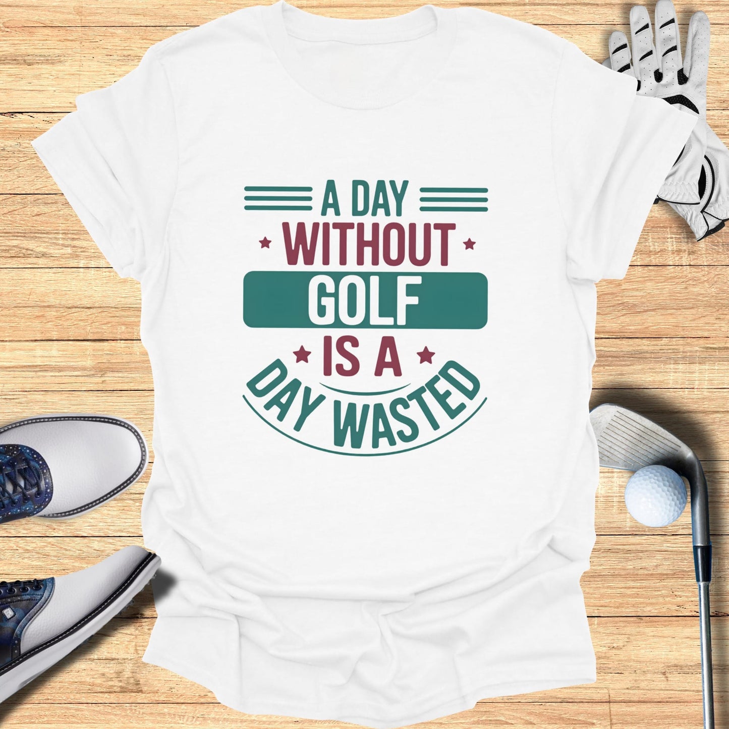 White t-shirt with green and blue text reading "A Day Without Golf Is A Day Wasted".