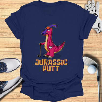 T-shirt with pink dinosaur golfing, "Jurassic Putt" text.