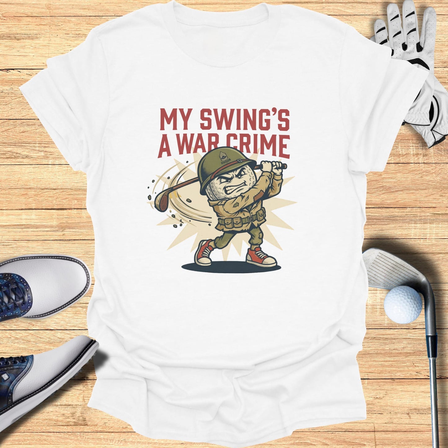 Golf t-shirt with cartoon soldier teeing off, text "MY SWING'S A WAR CRIME."