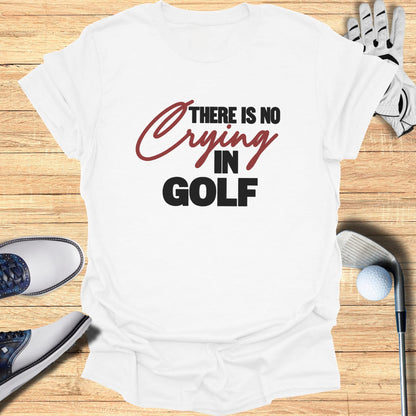 White t-shirt with "There Is No Crying In Golf" text and golf accessories.