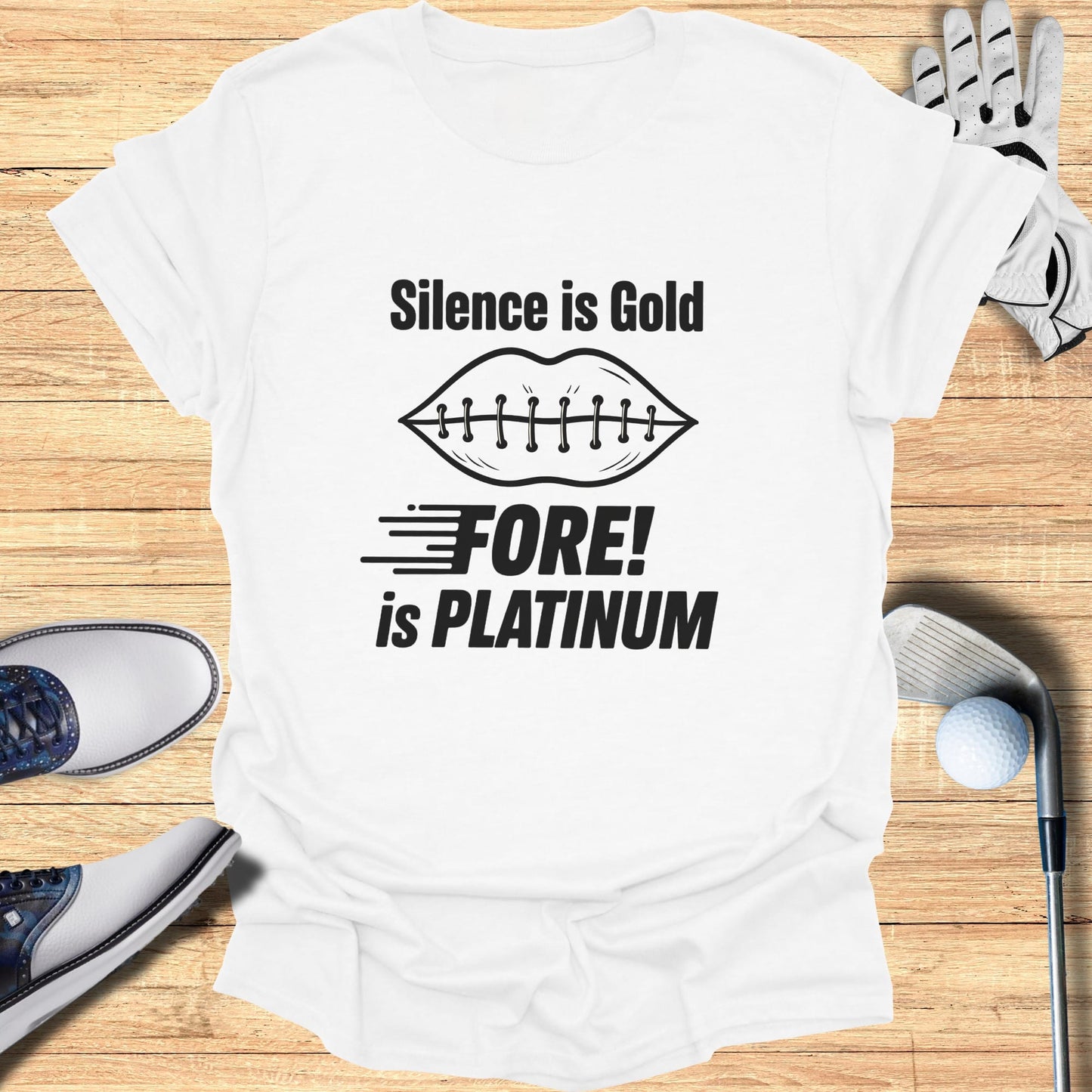 White t-shirt with "Silence is Gold FORE! is PLATINUM" graphic and golf accessories.
