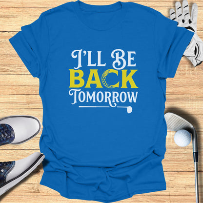 Blue t-shirt with white and yellow text that reads "I'LL BE BACK TOMORROW" and a golf ball graphic.
