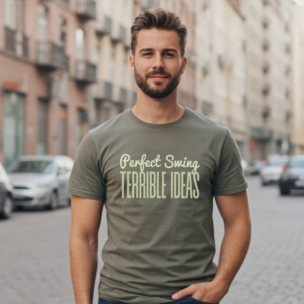 Man wearing olive green t-shirt with "Perfect Swing, Terrible Ideas" text.