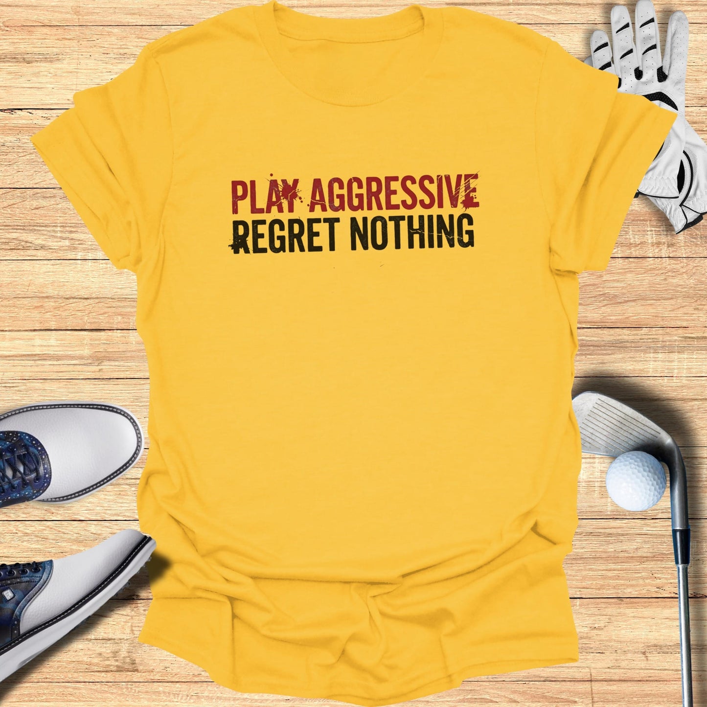 Yellow t-shirt with "PLAY AGGRESSIVE REGRET NOTHING" text.