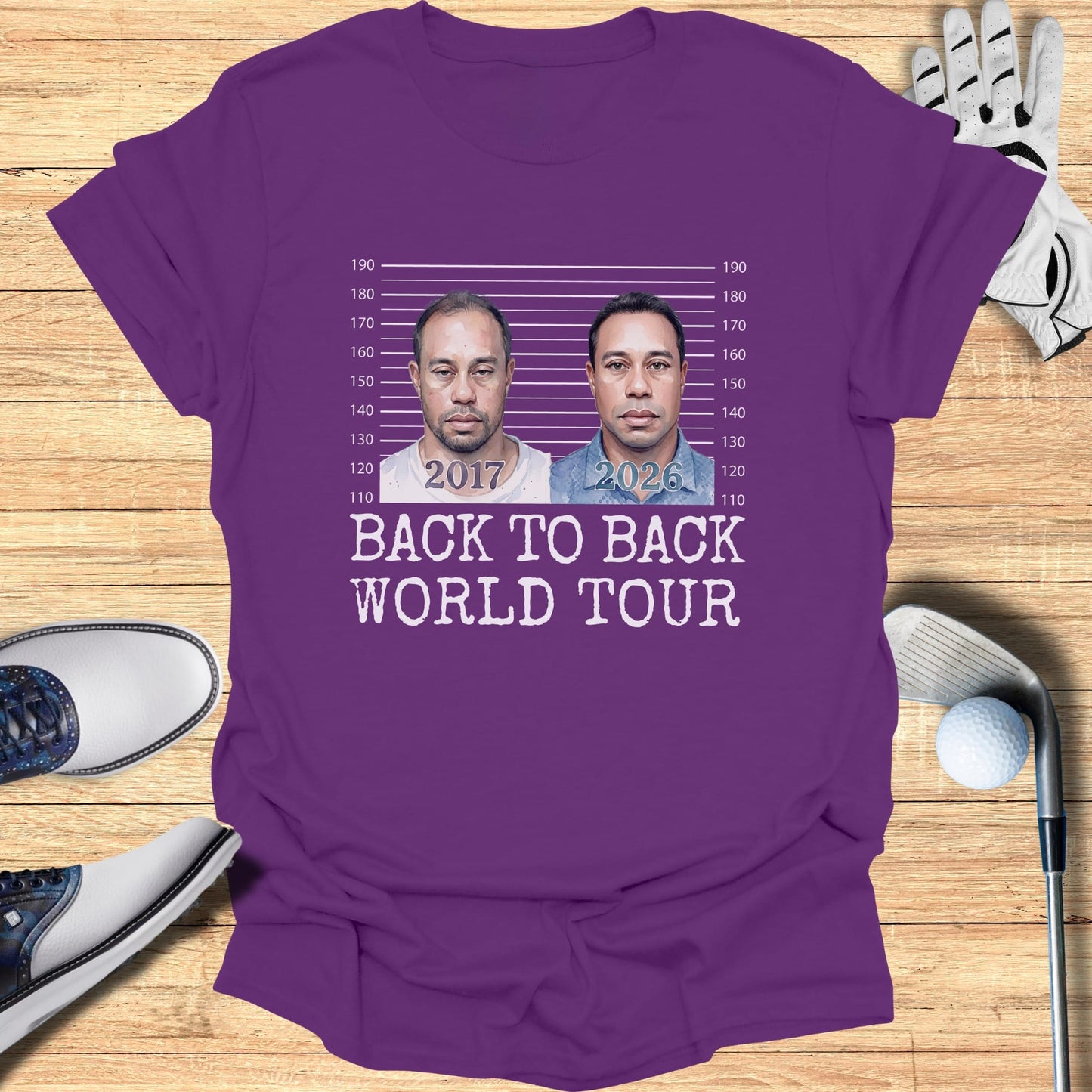 Purple t-shirt with mugshot of Tiger Woods and "2017 2026 BACK TO BACK WORLD TOUR".