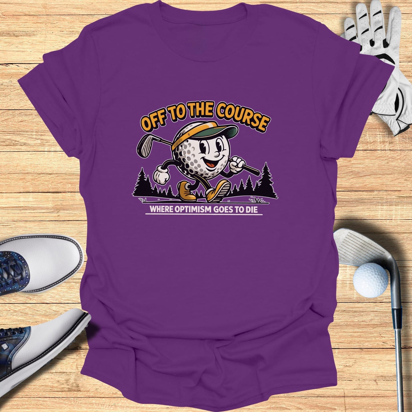 Purple t-shirt with cartoon golfer and text "Off to the Course, Where Optimism Goes to Die".