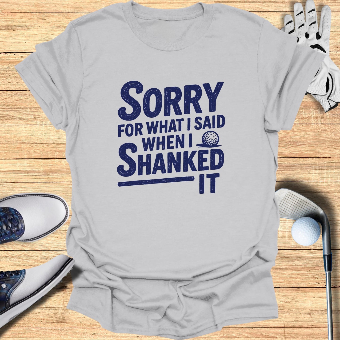 Gray t-shirt with "Sorry for what I said when I shanked it" text and golf items.